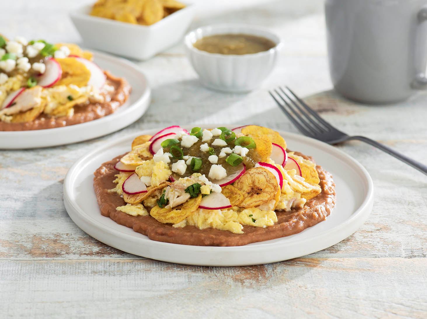 Plantain Chip “Chilaquiles” with Adobo Chicken, Refried Beans and Salsa Verde