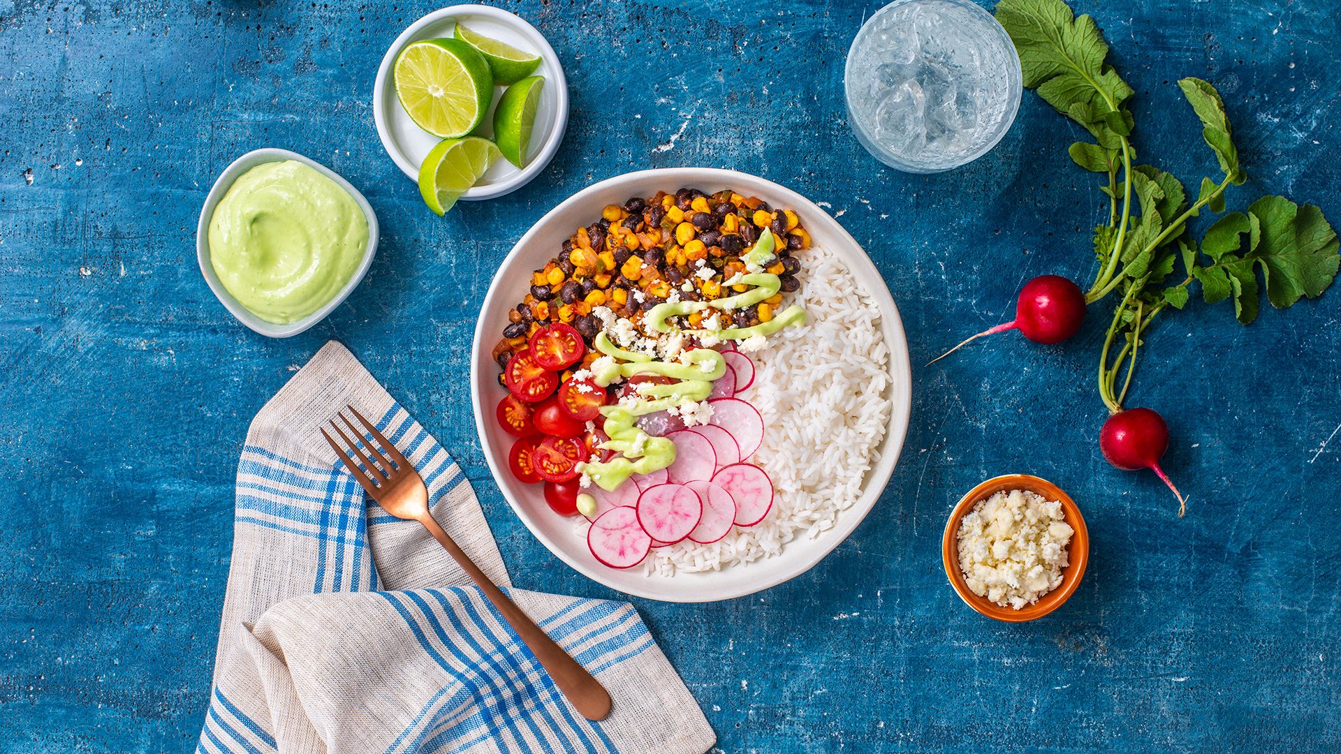 Sautéed Corn with Black Beans Bowl and Avocado Crema